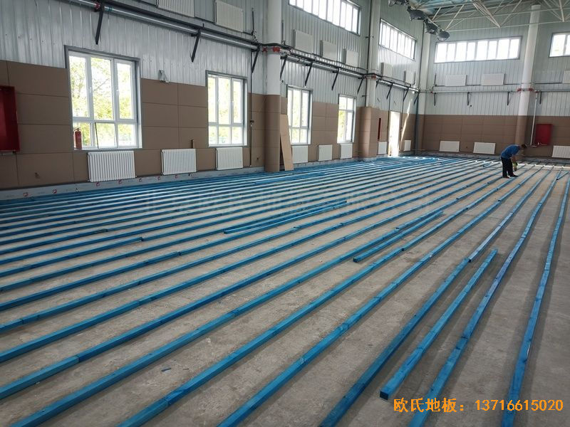 新疆克拉瑪依市獨(dú)山子虹園小區(qū)體育館體育木地板施工案例